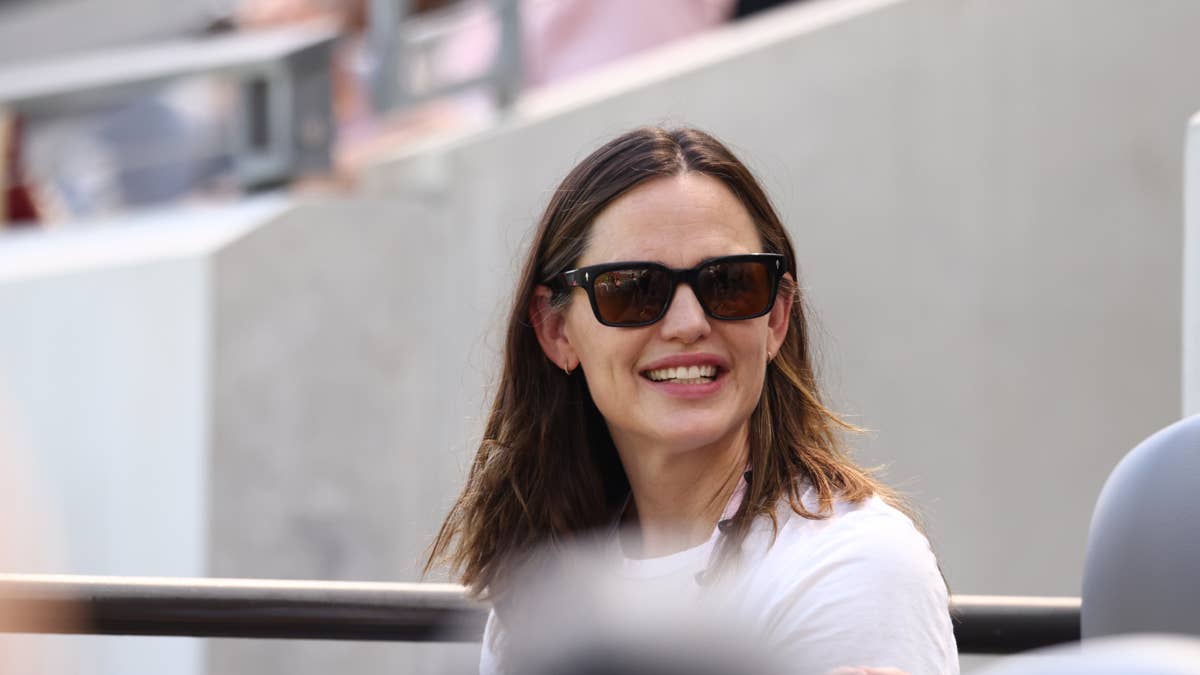 54-Year-Old Jennifer Garner Stuns in Rare Red Swimsuit Cover Photo