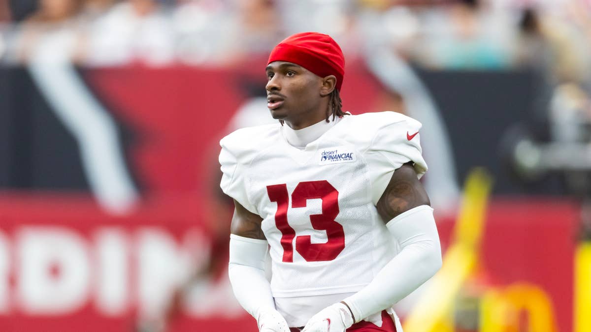 Kei'Trel Clark in a white Cardinals jersey with red number 13 and a red bandana.