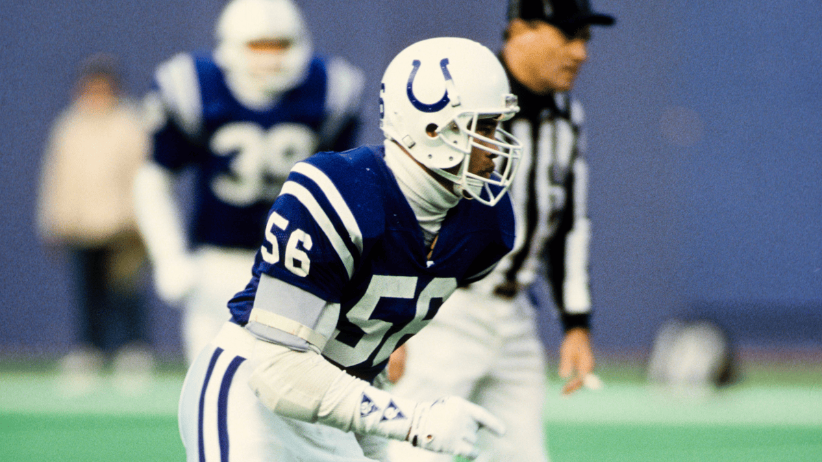 Fredd Young in a blue Colts jersey with number 56, white helmet with horseshoe logo.