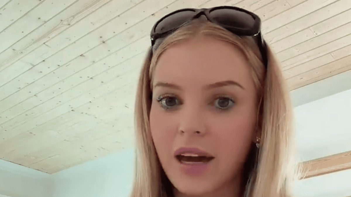 Landry Kiffin speaks with sunglasses on her head and blonde hair.