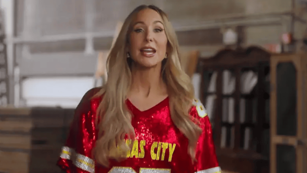Nikki Glaser in a red sequined Kansas City Chiefs jersey.