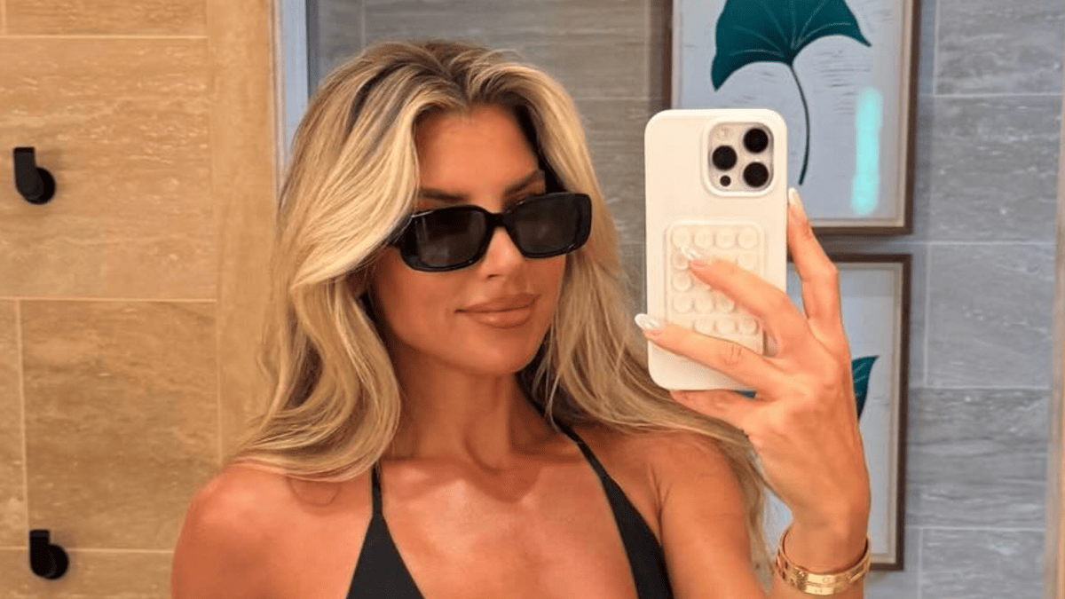 NFL Sideline Star Melanie Collins Stuns Fans in Black Swimsuit