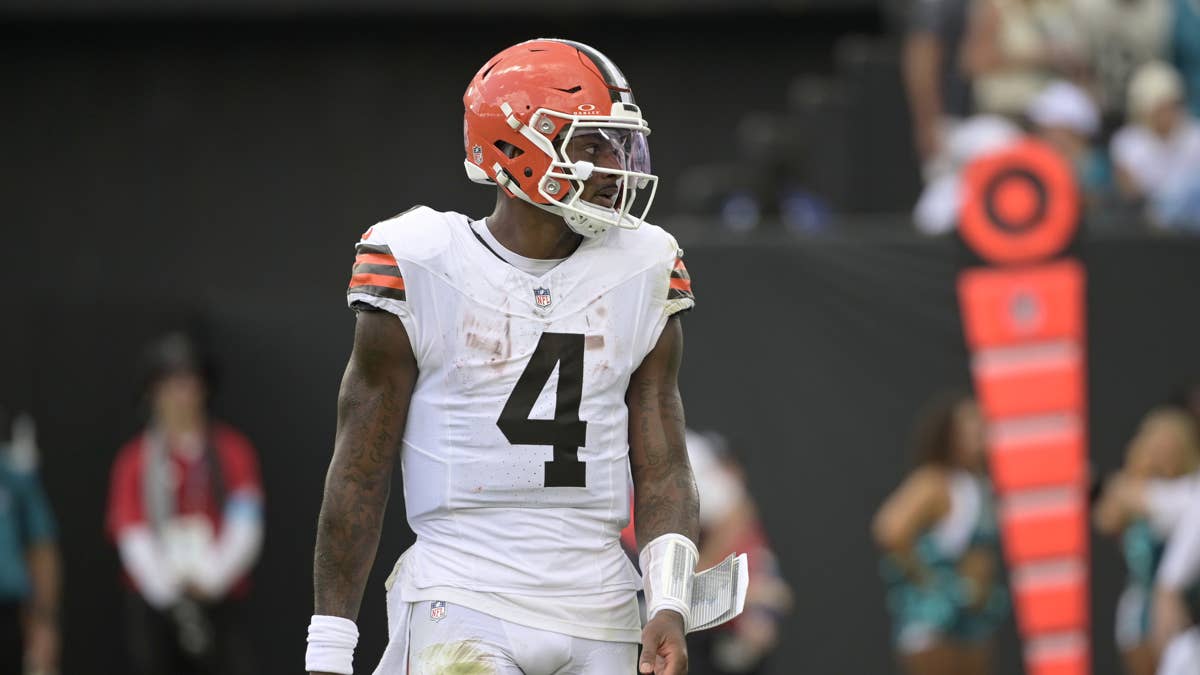 Deshaun Watson in a white Cleveland Browns jersey with number 4, wearing an orange helmet.